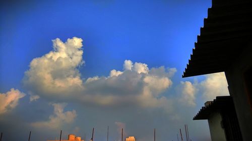 Low angle view of buildings against blue sky
