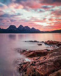 Scenic view of lake against sky during sunset