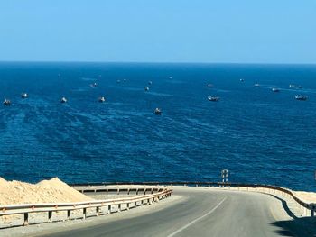 Scenic view of sea against clear blue sky