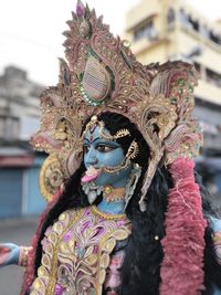 Close-up of durga statue on road in city