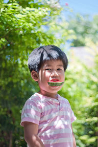 Portrait of a boy eating watermelon