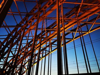 Low angle view of metallic structure against sky