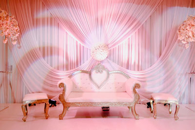 Full length of woman with pink umbrella