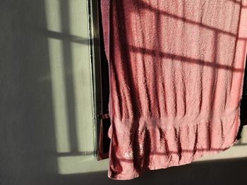 Close-up of clothes drying against wall
