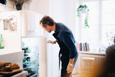 Young man looking at store