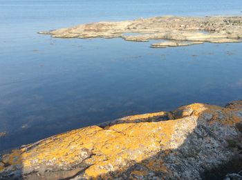 High angle view of rocks by sea