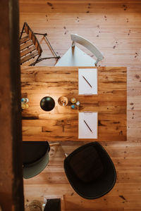 High angle view of clock on table