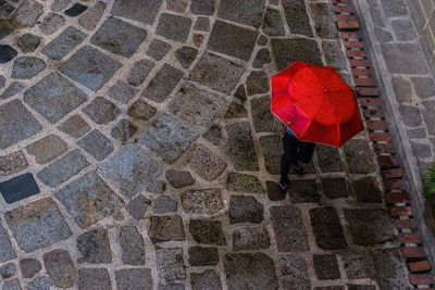 High angle view of woman walking on road