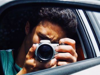Portrait of man photographing