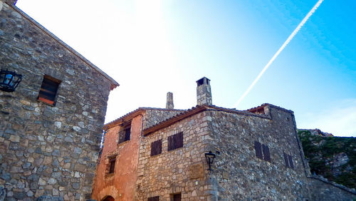 Low angle view of old building against sky