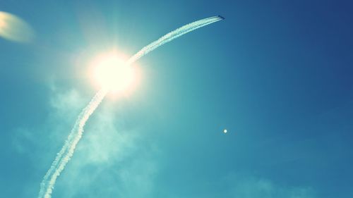 Low angle view of vapor trails in sky