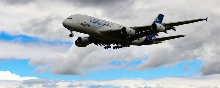 Low angle view of airplane flying in sky