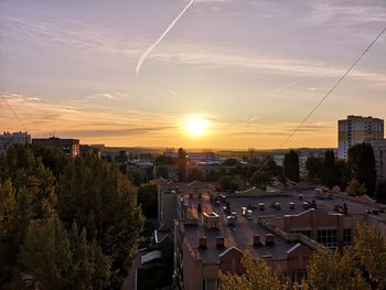 High angle view of buildings against sky during sunset