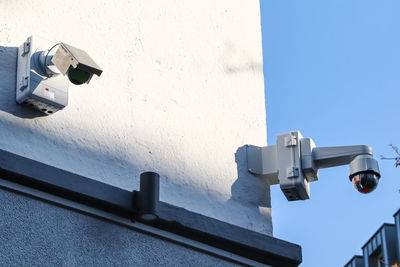 Low angle view of camera on wall