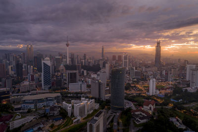 High angle view of city buildings during sunset