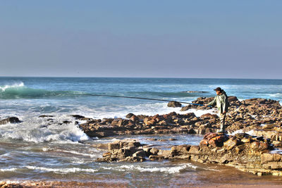 Scenic view of sea against clear sky