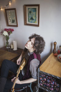 Young woman playing a guitar