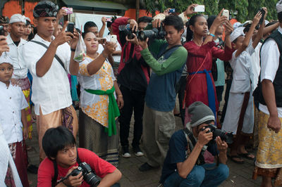 People photographing with mobile phones