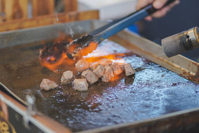 Close-up of meat on barbecue grill