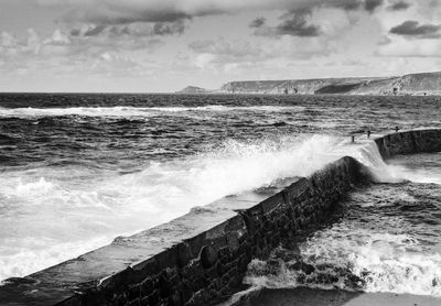 High angle view of waves splashing on shore 