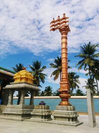 View of temple against cloudy sky