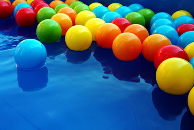 High angle view of multi colored balloons in swimming pool