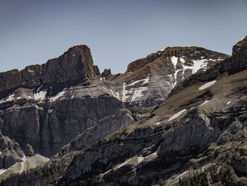 Scenic view of rocky mountains against clear sky