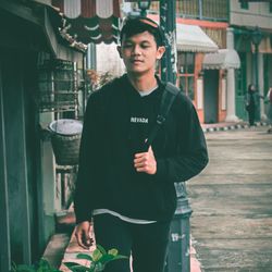 Portrait of young man standing outdoors