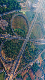 High angle view of highway amidst field in city