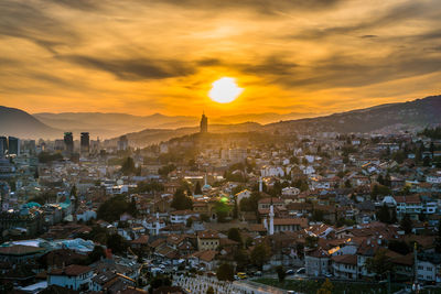 High angle view of townscape against sky during sunset