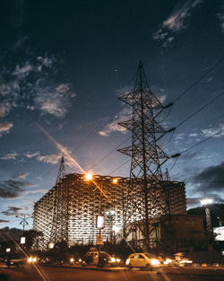 Low angle view of illuminated street light against sky at night