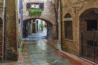 Alley amidst buildings in city