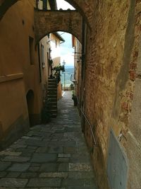 Archway amidst buildings in city