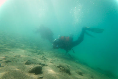 People swimming in sea