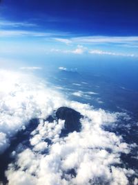 Aerial view of clouds over sea against sky