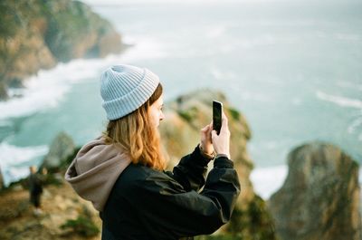 Man photographing with mobile phone