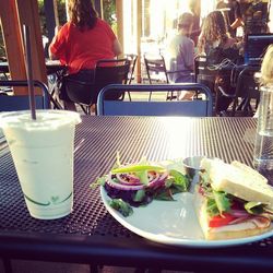 Woman eating food in restaurant