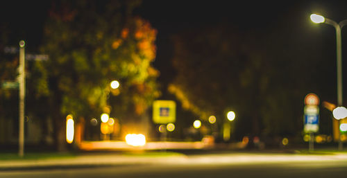 Defocused image of illuminated street lights at night