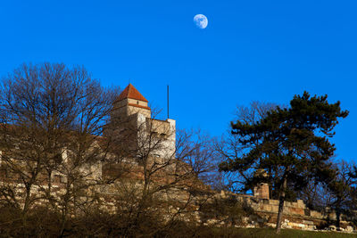 Low angle view of building against blue sky