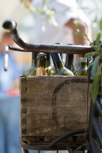 Close up of bottles in bicycle basket