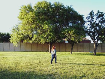 Full length of woman standing on grass