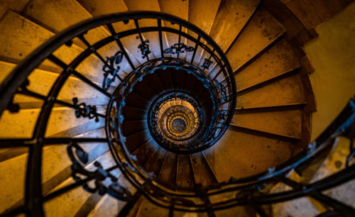 Directly below shot of spiral staircase in building