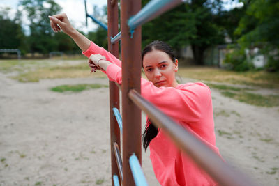 Portrait of woman standing in playground