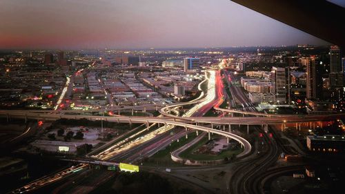 High angle view of illuminated cityscape at night