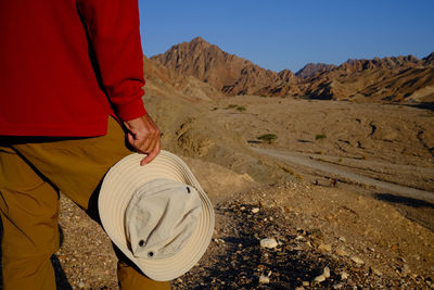 Rear view of senior man standing on mountain