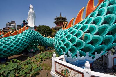 Panoramic view of temple against building