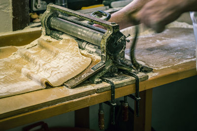 Close-up of person working on cutting board