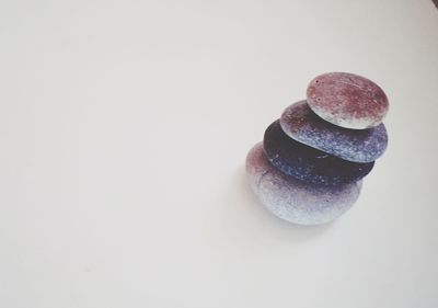 Close-up of stones against white background