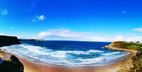 Scenic view of sea against blue sky