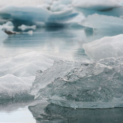 Close-up of frozen sea against sky